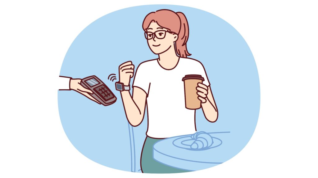Young woman paying for her takeaway coffee with a smart watch