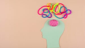 Picture of a brain with multicoloured strings coming out