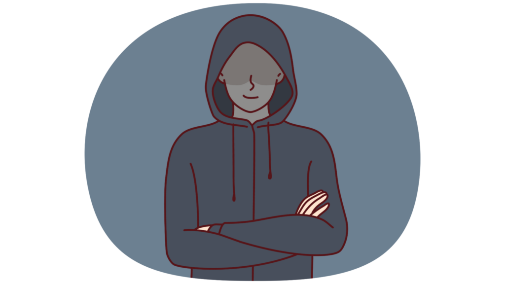 Man with his hood up looking forward ominously.