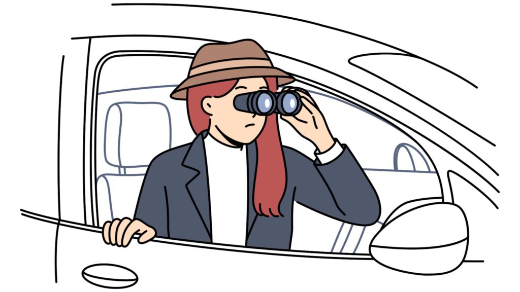 Lady looking outside her car with bincoculars