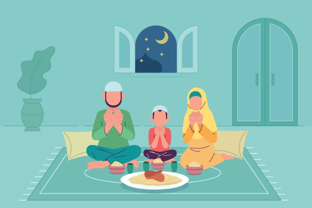 Family of muslims praying before breaking fast during Ramadan