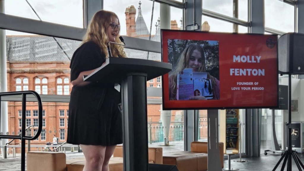 Molly Fenton giving a presentation in the Senedd building in Cardiff Bay