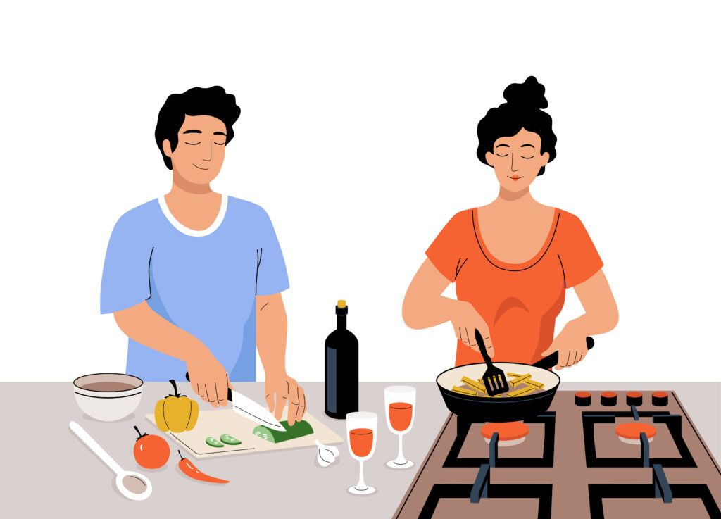A man and a woman cooking dinner together