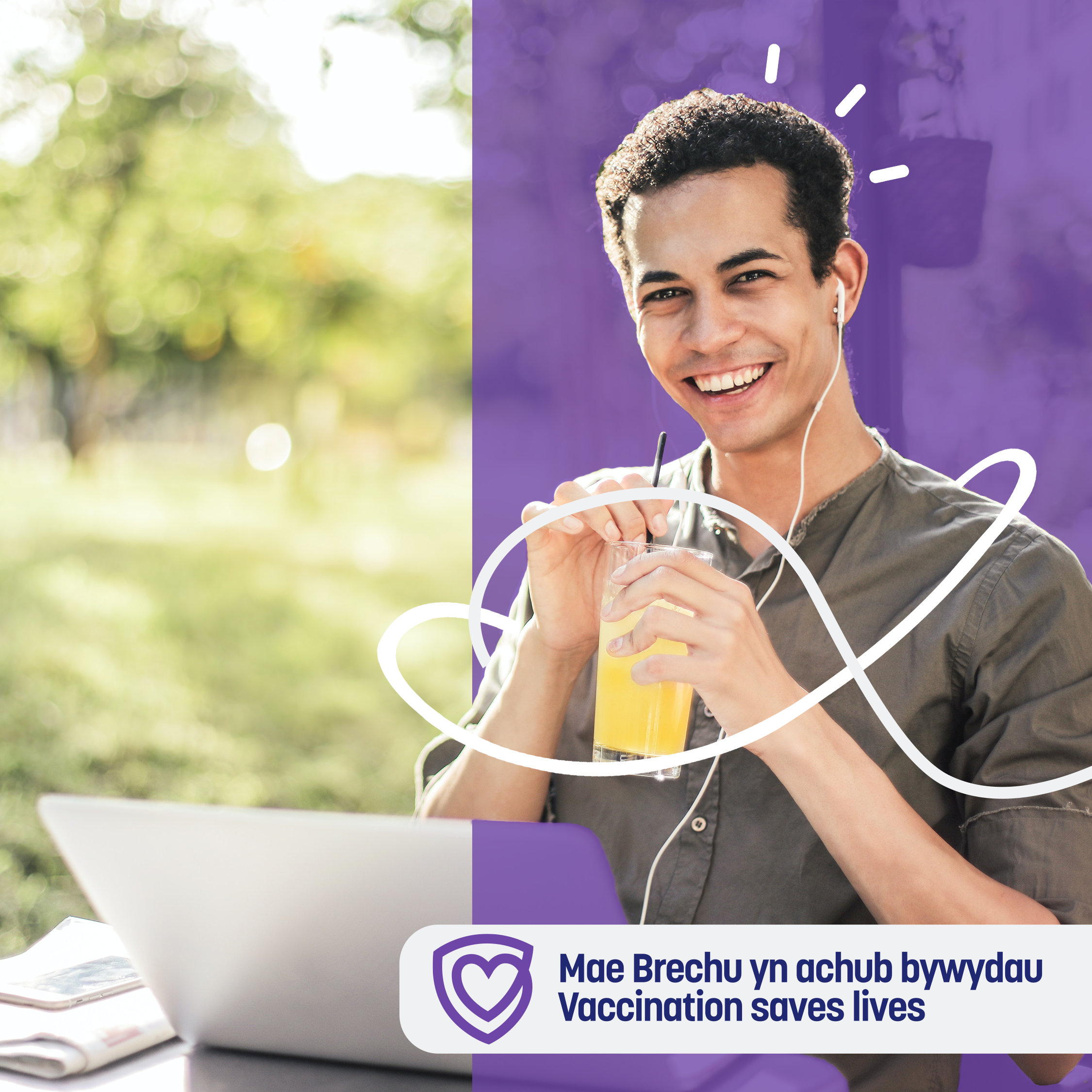 Young male drinking a orange drink through a straw, buds in his ears and laptop on front of him. With the words 'Vaccination saves lives'