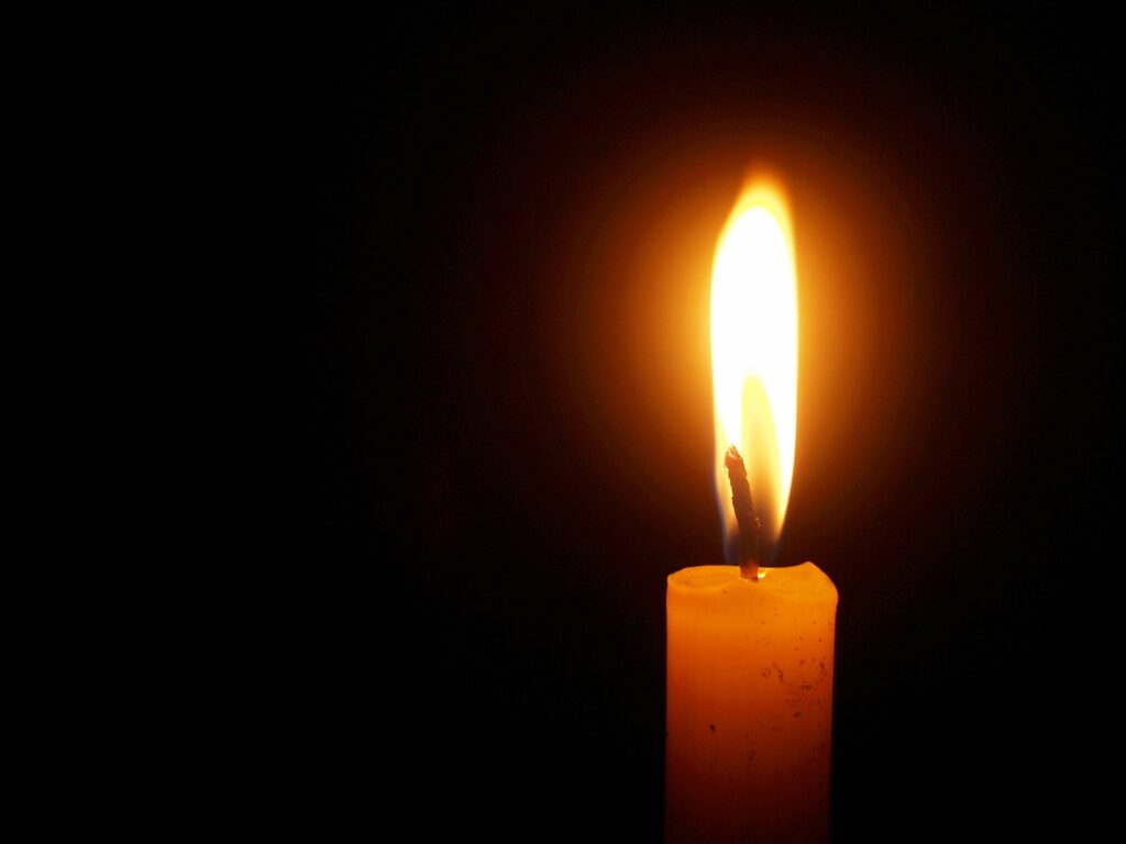Close up of a flame on top of a candle