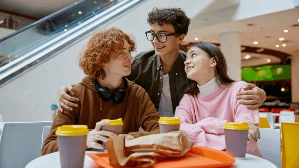 Group of 3 friends having coffee together