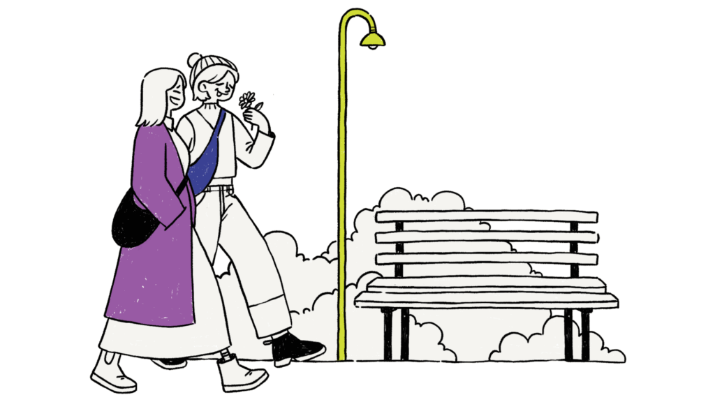 Two people walking together in a park