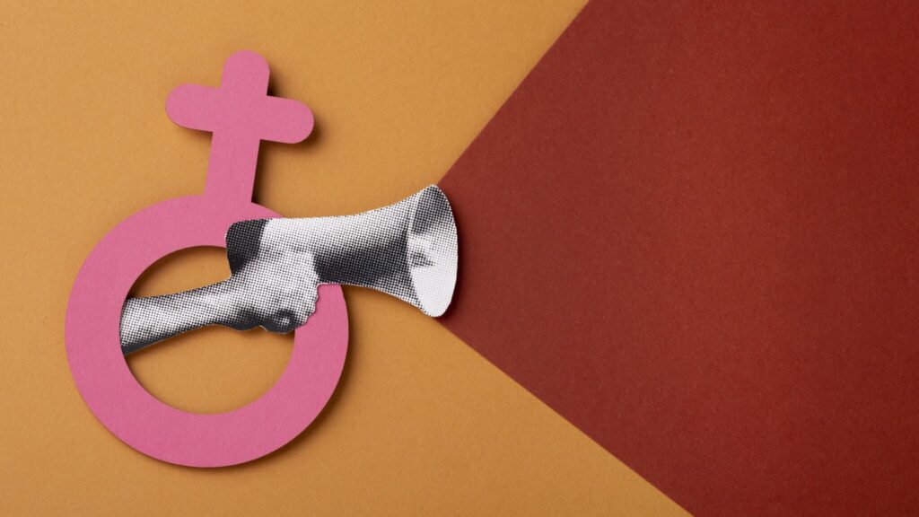 A hand holding a megaphone within the female logo