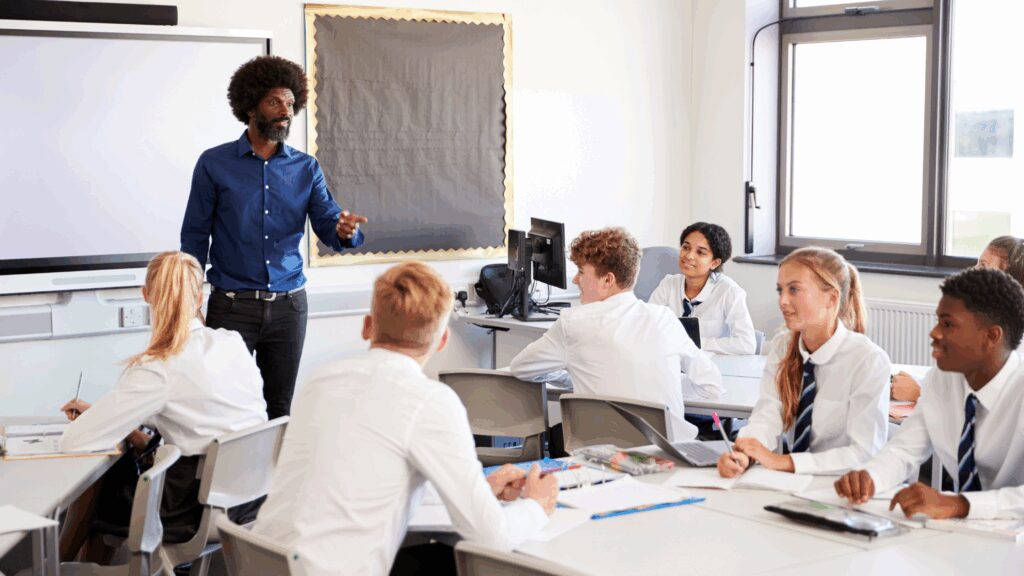Male teacher talking to a classroom of students
