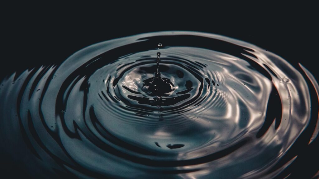 A drop of water into a puddle