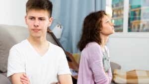Mother and son in argument on the sofa