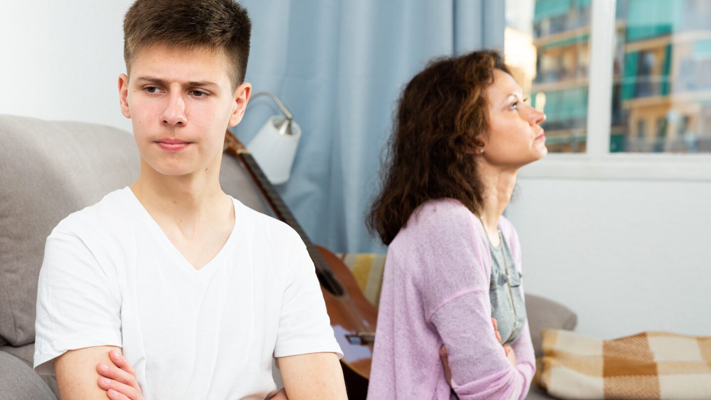 Mother and son in argument on the sofa