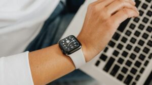 Person looking at time on watch