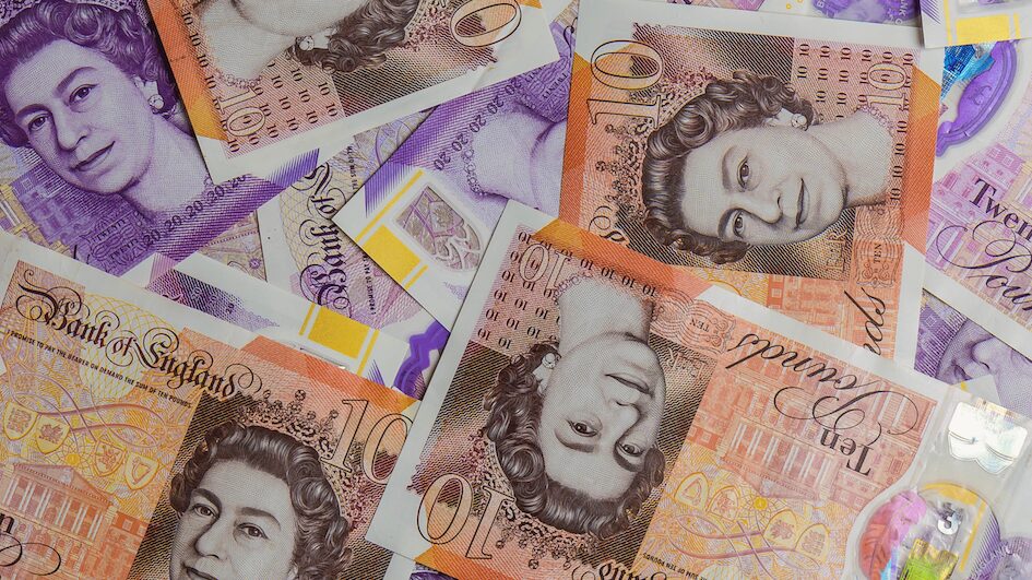 Wad of cash sprawled on table