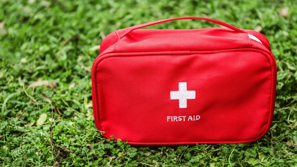 First aid kit on grass