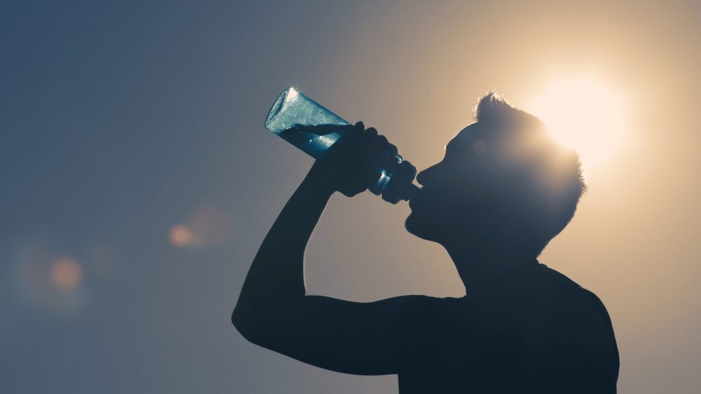 Teen drinking water for hydration